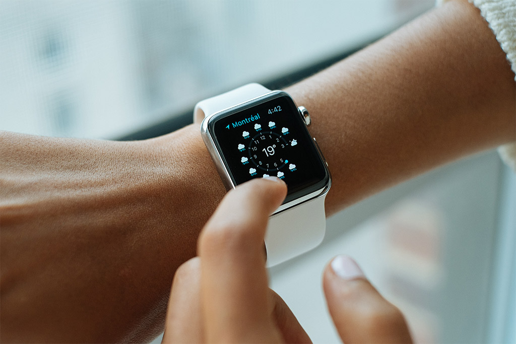 image of arm with an apple watch depicting four time-saving tips