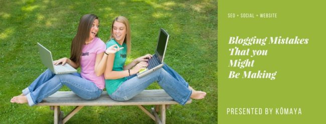 Two young women sitting on a bench with laptops depicting blogging mistaskes