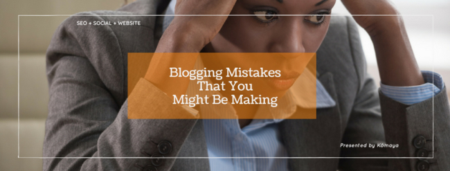 professional lady with hands on head looking at a computer depicting blogging mistakes that you might be making